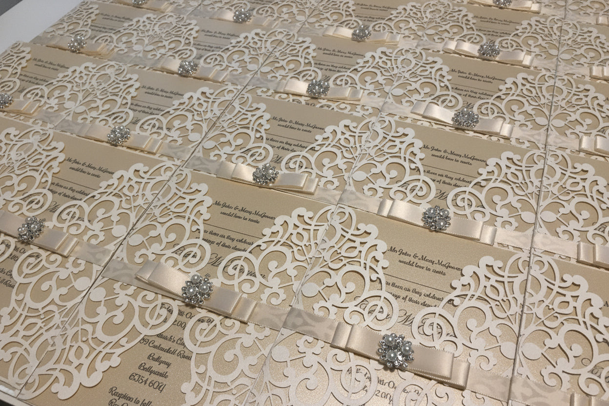 Ivory Laser Cut Wedding Invitation with Pearlised Card, Bow & Gem